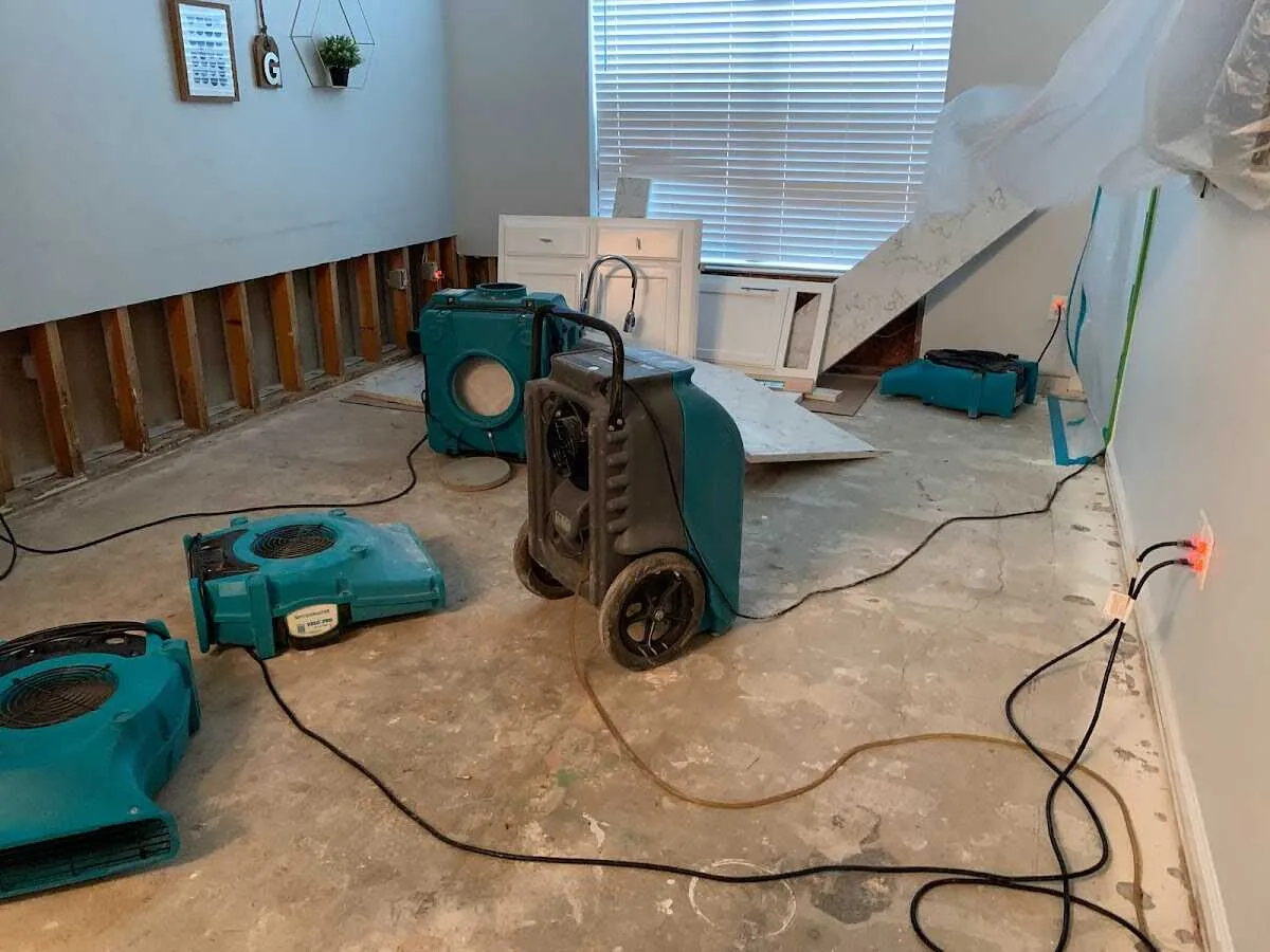 Dehumidifier in flood-cut room for Water Damage Restoration in Meredith